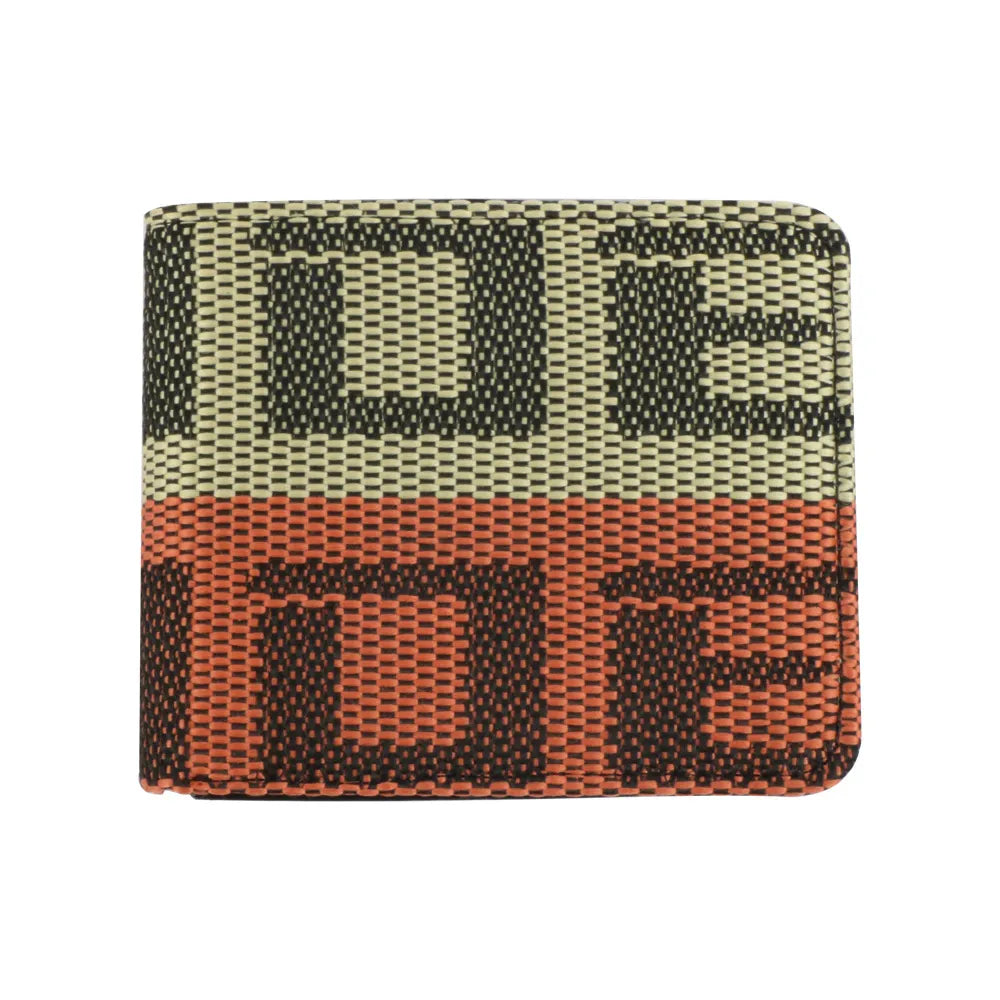 A woven bifold wallet with a geometric pattern in olive green, terracotta orange, and dark brown, featuring the brand name 'DE' in large letters across the front.