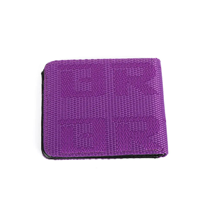 A purple textured bifold wallet with a woven geometric pattern, shown closed on a plain white background.