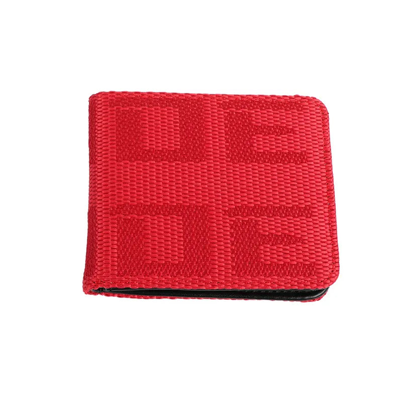 A red woven bifold wallet with a tonal geometric pattern, shown on a plain white background.