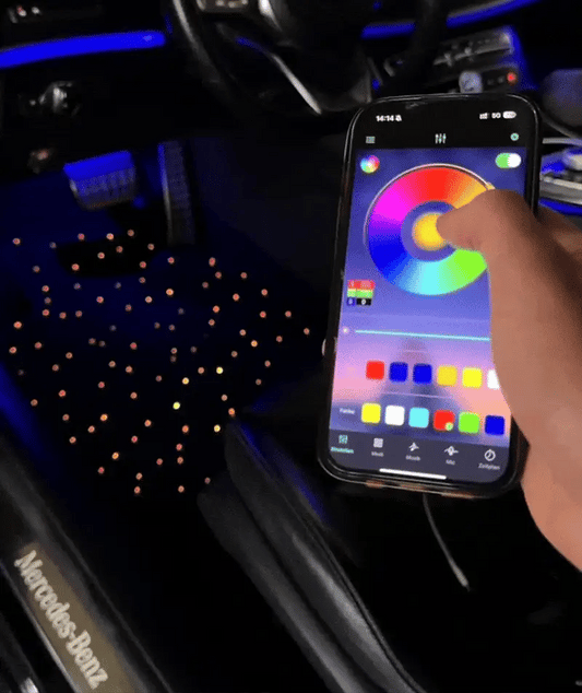 Phone app controlling car interior galaxyglow starlight floor mats lighting with Mercedes-Benz logo visible