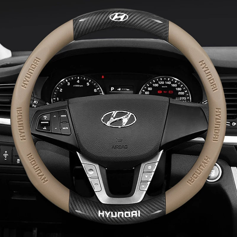 Steering wheel with brown cover and Hyundai logo on a dark background