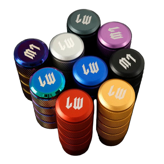 Colorful metal grinder caps with 'lw' logo