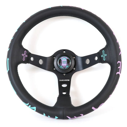 A black leather-wrapped car steering wheel with a matching black three-spoke center, featuring pastel pink and light blue decorative accents along the rim and a colorful iridescent center cap, shown on a white background.
