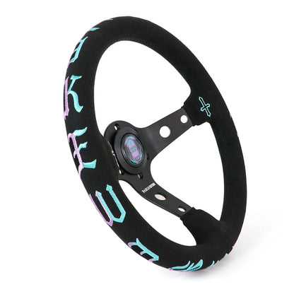 A black multi-spoke steering wheel with a black suede-like rim cover featuring light blue and purple gothic lettering, shown on a white background.