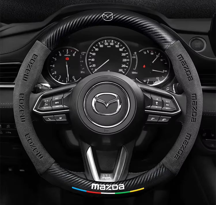 Mazda steering wheel with dashboard in the background
