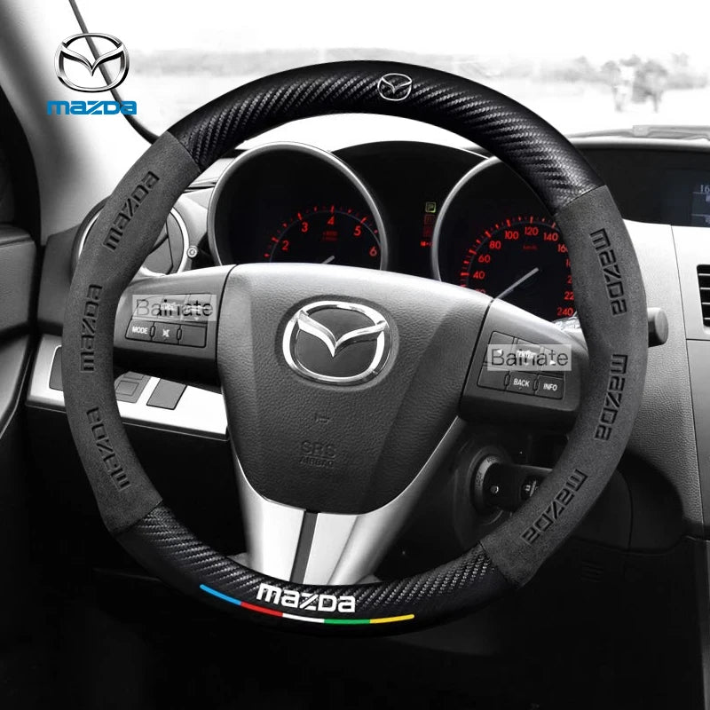 Steering wheel cover with Mazda logo on a car dashboard