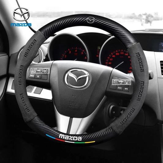 Steering wheel cover with Mazda logo on a car dashboard