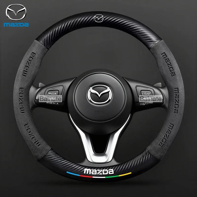 Mazda steering wheel with brand logo on a dark background