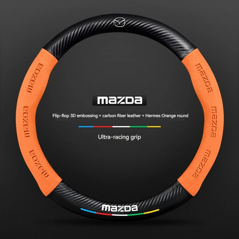 Mazda steering wheel cover with orange and black design on a dark background