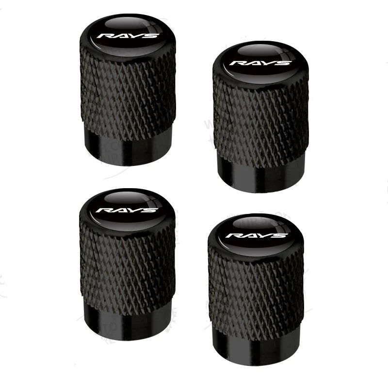 Four black valve stem caps with 'RAVS' branding on a white background.