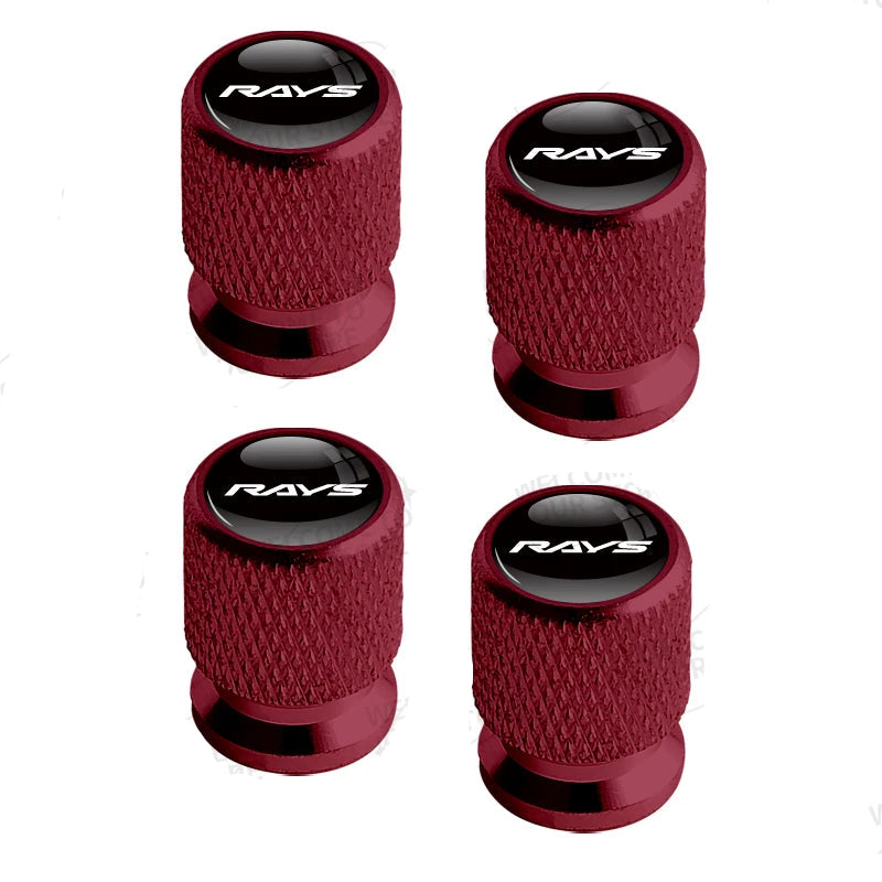 Four red valve stem caps with 'RAYS' branding on a white background.