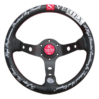 Black steering wheel with white text and red accents