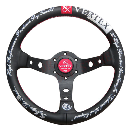 Black steering wheel with white text and red accents