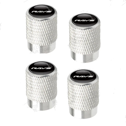 Four silver valve stem caps with black centers featuring 'RAVS' branding on a white background.