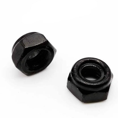 Two black hex nuts on a white background