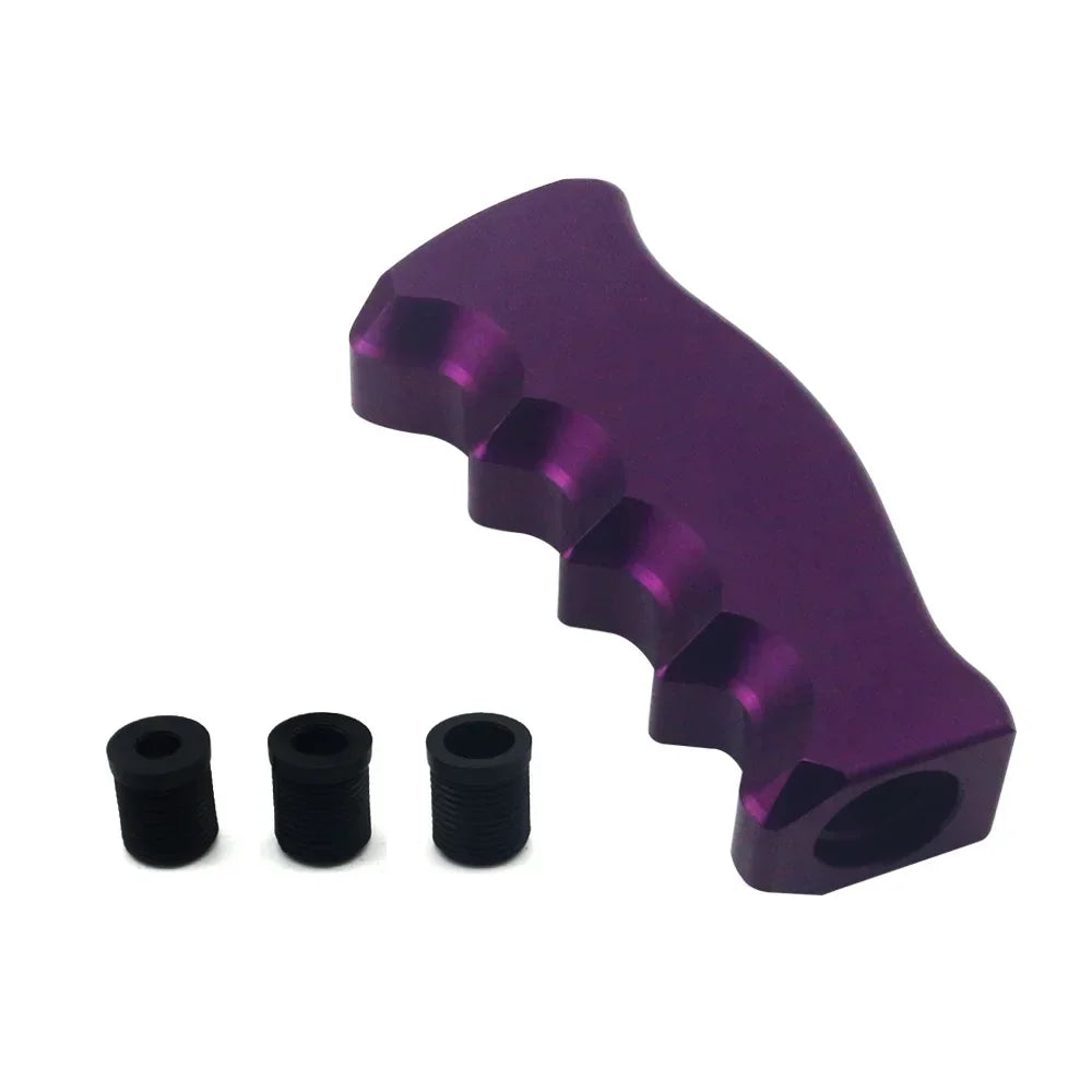 Close-up of the pistol grip shift knob aluminium finish and grip texture