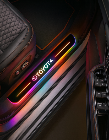 Car door interior with Toyota logo and colorful light strip