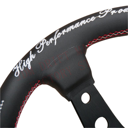 Black steering wheel with red stitching on a white background